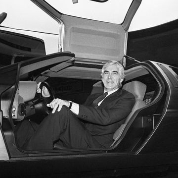 John DeLorean Sitting in Sports Car
